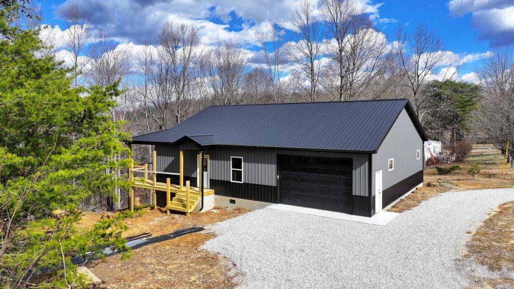 Barndominium with grey and black siding.