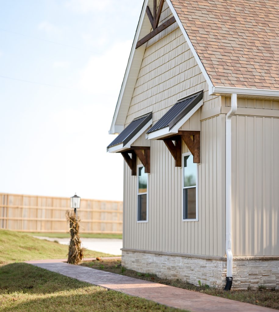 Close up showing windows on a custom house Triple J Builders built
